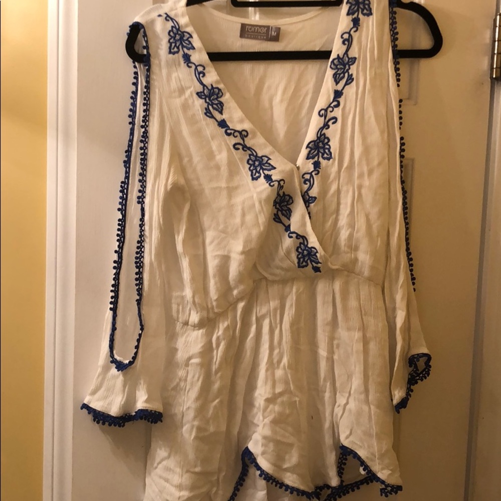 White romper with blue flower detailing from LF